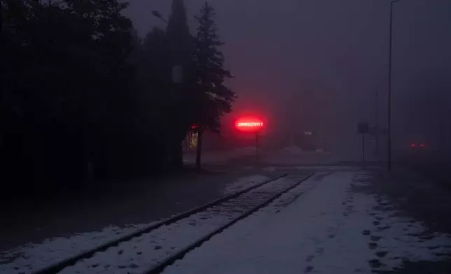 Snow covers railroad tracks that were once used to transport Jews from across Europe to Auschwitz, the Nazi German extermination and labor camp, in Oswiecim, Poland, on Jan. 23. 2025. (AP Photo/Oded Balilty, File)