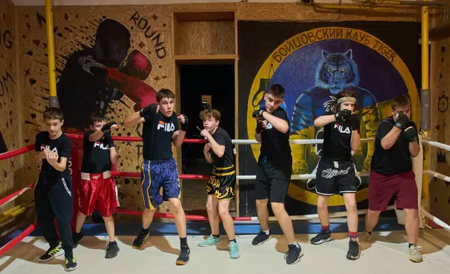 Children practice at a boxing school in an underground shelter in the frontline city of Kherson, southern Ukraine, on Nov. 2, 2025. (AP Photo/Efrem Lukatsky, File)