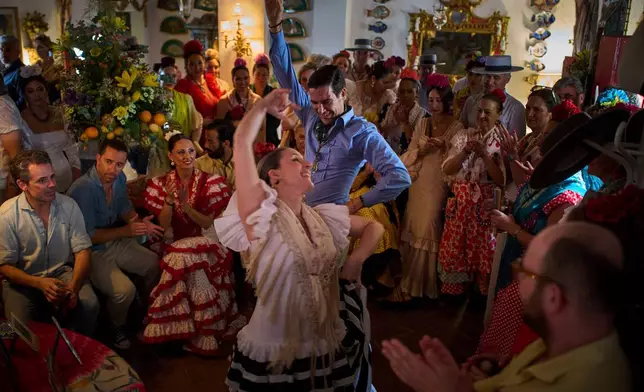 Pilgrims dance the Sevillanas on June 8, 2025, during the annual Catholic pilgrimage to the shrine of the Virgin of El Rocio that draws hundreds of thousands of faithful in El Rocio, Spain. (AP Photo/Emilio Morenatti, File)