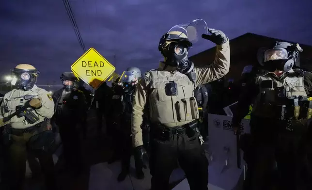 Law enforcement officers standoff against protesters outside an ICE processing facility in the Chicago suburb of Broadview, Ill., on Nov. 1, 2025. (AP Photo/Alex Brandon, File)