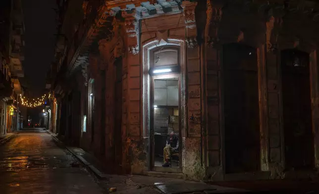 A man smokes a cigarette in a state-run bodega in Havana on Jan. 20, 2025. (AP Photo/Ramon Espinosa, File)