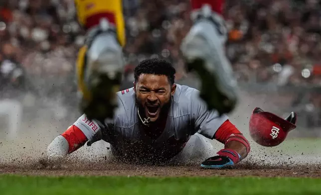St. Louis Cardinals' Victor Scott II scores against the San Francisco Giants during a baseball game in San Francisco on Sept. 23, 2025. (AP Photo/Godofredo A. Vásquez, File)