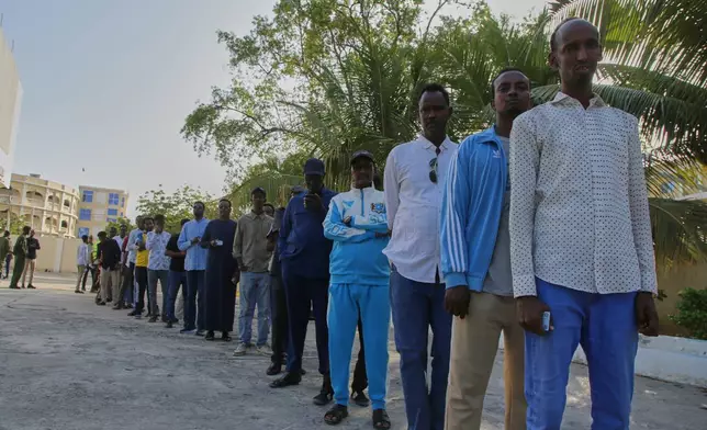 People queue to cast their votes during the local election in Mogadishu, Somalia, Thursday, Dec. 25, 2025. (AP Photo/Farah Abdi Warsameh)