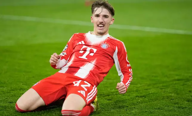 Bayern's Lennart Karl celebrates after scoring his side's second goal during the Champions League opening phase soccer match between FC Bayern Munich and Sporting CP in Munich, Germany, Tuesday, Dec. 9, 2025. (AP Photo/Matthias Schrader)