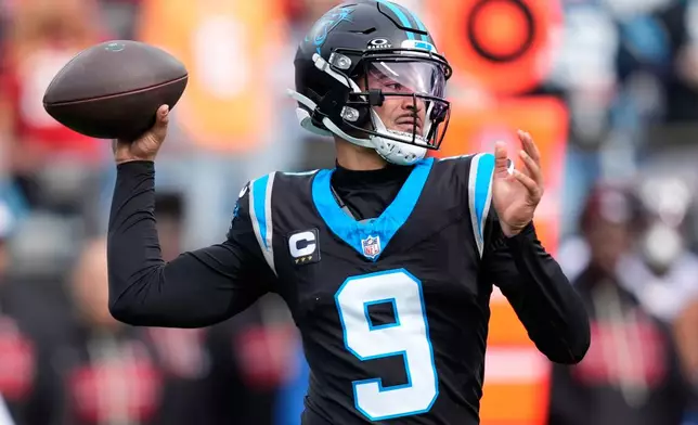Carolina Panthers quarterback Bryce Young passes against the Tampa Bay Buccaneers during the first half of an NFL football game, Sunday, Dec. 21, 2025, in Charlotte, N.C. (AP Photo/Erik Verduzco)