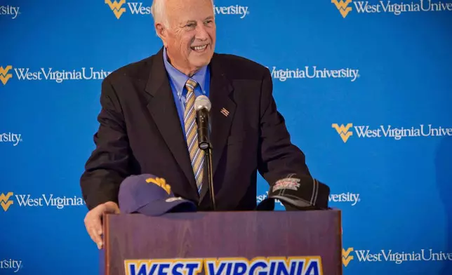 FILE - Big 12 Conference Interim Commissioner Chuck Neinas speaks during a news conference to announce West Virginia's entrance into the conference, Nov. 1, 2011, in Morgantown, W.Va. (AP Photo/David Smith, File)