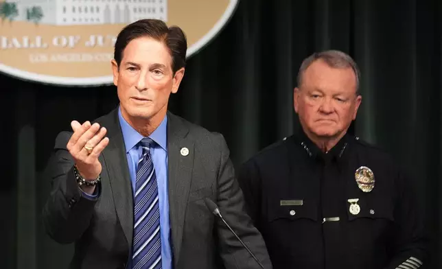 Los Angeles District Attorney Nathan Hochman, left, and LAPD Chief Jim McDonnell announce developments about the murder case of Rob Reiner and his wife Michele Tuesday, Dec. 16, 2025, in Los Angeles. (AP Photo/Damian Dovarganes)