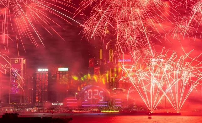FILE - Fireworks explode over Victoria Harbour to celebrate the start of 2025 at Tsim Sha Tsui in Hong Kong, Jan. 1, 2025. (AP Photo/Chan Long Hei, File)