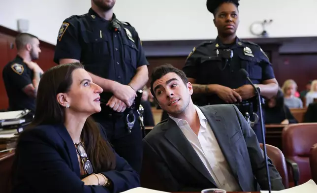 Luigi Mangione appears in Manhattan Criminal Court for an evidence hearing, Thursday, Dec. 4, 2025, in New York. (Angela Weiss/Pool Photo via AP)