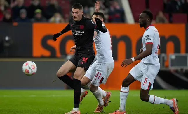 Leverkusen's Patrik Schick misses to score during the Bundesliga soccer match between FC Augsburg and Bayer Leverkusen in Augsburg, Germany, Dec. 6, 2025. (AP Photo/Matthias Schrader)