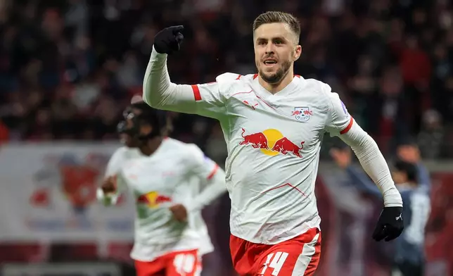 Leipzig's Christoph Baumgartner celebrates after scoring his side's second goal during the German Bundesliga soccer match between RB Leipzig and Eintracht Frankfurt in Leipzig, Germany, Saturday, Dec. 6, 2025. (Jan Woitas/dpa via AP)
