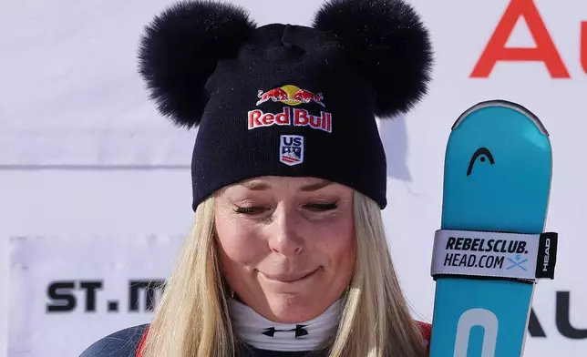 United States' Lindsey Vonn gets emotional as she celebrates winning an alpine ski, women's World Cup downhill, in St. Moritz, Switzerland, Friday Dec. 12, 2025. (AP Photo/Luciano Bisi)
