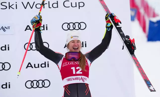 Valerie Grenier, of Canada, celebrates a third place finish in the women's World Cup giant slalom in Mont Tremblant, Quebec, Saturday, Dec. 6, 2025. (Sean Kilpatrick/The Canadian Press via AP)
