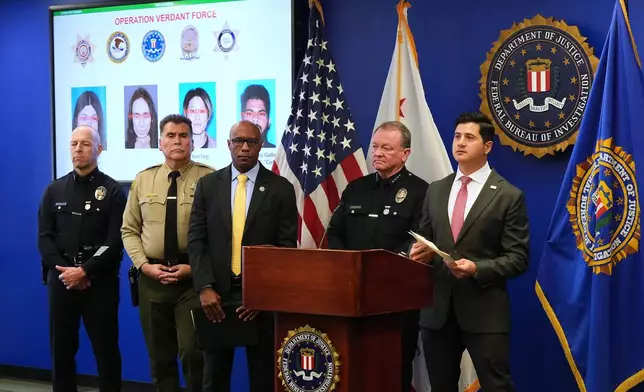 First Assistant United States Attorney Bill Essayli, right, speaks during a press conference announcing developments on a terrorism investigation Monday, Dec. 15, 2025, in Los Angeles. (AP Photo/Damian Dovarganes)