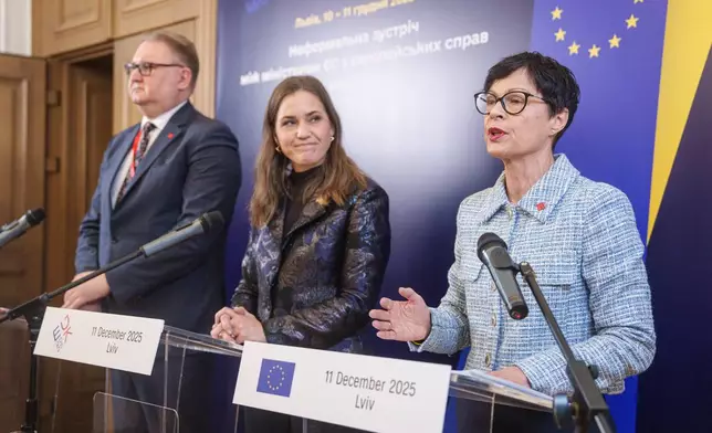 EU Commissioner for Enlargement Marta Kos, right, attends a joint press conference with Ukraine's Deputy Prime Minister for European and Euro-Atlantic Integration of Ukraine Taras Kachka, left, and Marie Bjerre, Danish Minister for European Affairs, after informal meeting of EU ministers for European affairs in Lviv, Ukraine, on Thursday, Dec. 11, 2025. (AP Photo/Evgeniy Maloletka)
