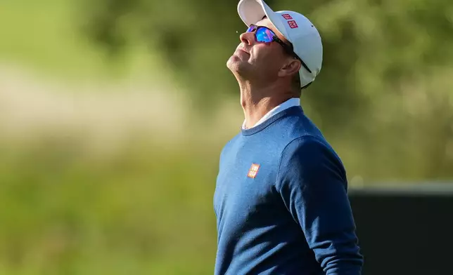 Adam Scott, of Australia, reacts after missing a putt on the 10th hole during the first round of the Australian Open golf tournament in Melbourne, Australia, Thursday, Dec. 4, 2025. (AP Photo/Asanka Brendon Ratnayake)