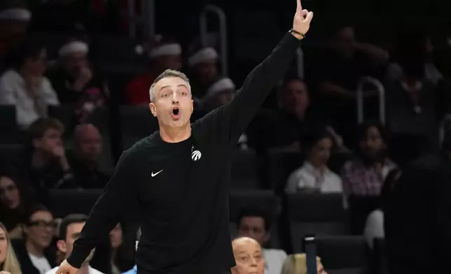 Toronto Raptors head coach Darko Rajakovic reacts during the first half of an NBA basketball game against the Miami Heat, Tuesday, Dec. 23, 2025, in Miami. (AP Photo/Lynne Sladky)