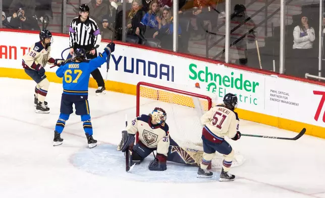 Toronto Sceptres' Emma Woods (67) celebrates a goal against Montreal Victoire goaltender Ann-Renee Desbiens (35) scores a goal during the first period of a PWHL Takeover Tour game in Halifax, on Wednesday, Dec. 17, 2025. (Riley Smith/The Canadian Press via AP)