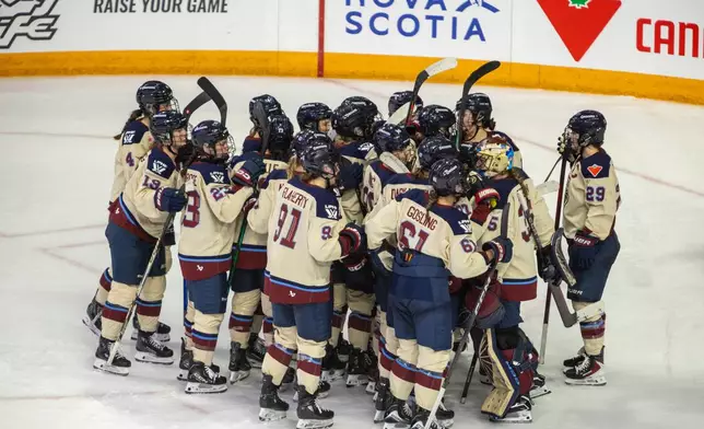Montreal Victoire players celebrate their shootout win over the Toronto Sceptres in PWHL Takeover Tour game in Halifax, Wednesday, Dec. 17, 2025. (Riley Smith/The Canadian Press via AP)