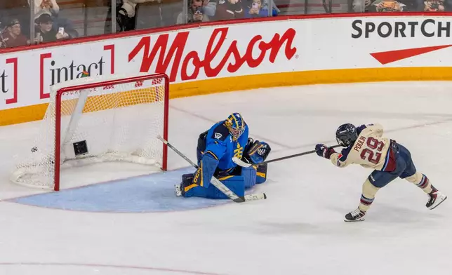 Montreal Victoire's Marie-Philip Poulin (29) scores on Toronto Sceptres goaltender Raygan Kirk (1) during a shootout in PWHL Takeover Tour game in Halifax, Wednesday, Dec. 17, 2025. (Riley Smith/The Canadian Press via AP)