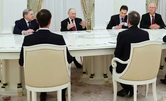 Russian President Vladimir Putin, second left, Russian Presidential foreign policy adviser Yuri Ushakov, left, and Russian Direct Investment Fund CEO Special Presidential Representative for Investment and Economic Cooperation with Foreign Countries Kirill Dmitriev, right, attend talks with U.S. special envoy Steve Witkoff, right back to a camera, and Jared Kushner, U.S. President Donald Trump's son-in-law, left back to a camera, at the Senate Palace of the Kremlin in Moscow, Russia, Tuesday, Dec. 2, 2025. (Alexander Kazakov, Sputnik, Kremlin Pool Photo via AP)