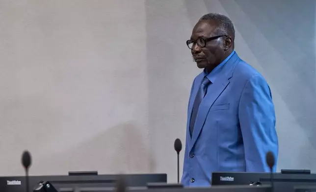 Ali Muhammad Ali Abd al-Rahman, a leader of the Sudanese Janjaweed militia, enters the court room at the International Criminal Court, ICC, in The Hague, Netherlands, Tuesday, Dec. 9, 2025. (AP Photo/Peter Dejong, Pool)