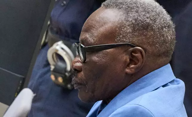 Ali Muhammad Ali Abd al-Rahman, a leader of the Sudanese Janjaweed militia, at the International Criminal Court, ICC, in The Hague, Netherlands, Tuesday, Dec. 9, 2025. (AP Photo/Peter Dejong, Pool)