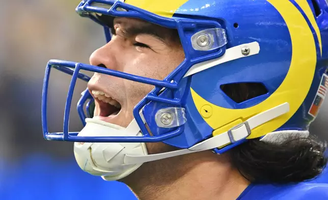 Los Angeles Rams wide receiver Puka Nacua (12) reacts after a first down during the first half of an NFL football game against the Detroit Lions, Sunday, Dec. 14, 2025, in Inglewood, Calif. (AP Photo/Katie Chin)