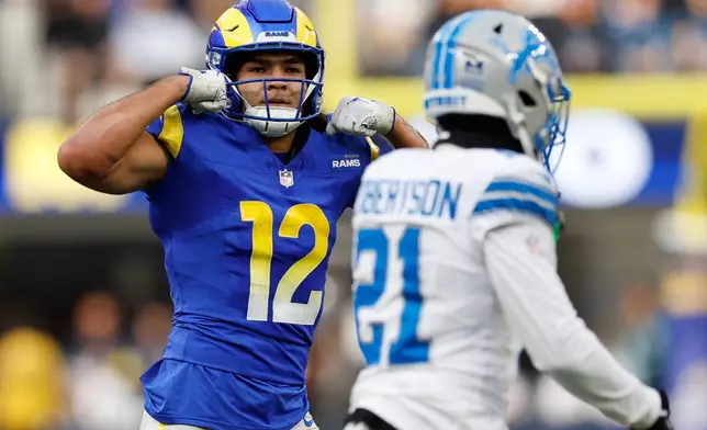 Los Angeles Rams wide receiver Puka Nacua (12) reacts after a catch during the first half of an NFL football game against the Detroit Lions, Sunday, Dec. 14, 2025, in Inglewood, Calif. (AP Photo/Caroline Brehman)