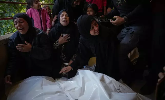 Mourners attend the funeral of Palestinians killed in an Israeli military strike, at Nasser Hospital in Khan Younis, Gaza Strip, Thursday, Dec. 4, 2025. (AP Photo/Abdel Kareem Hana)