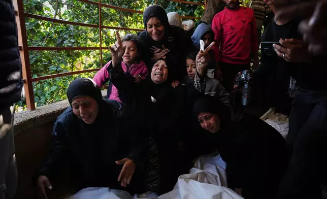 Mourners attend the funeral of Palestinians killed in an Israeli military strike, at Nasser Hospital in Khan Younis, Gaza Strip, Thursday, Dec. 4, 2025. (AP Photo/Abdel Kareem Hana)