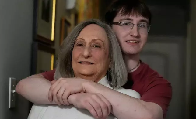 Donna West and her grandson Paul Quirk pose for a photo, Tuesday, Dec. 2, 2025, in Marietta, Ga. (AP Photo/Mike Stewart)