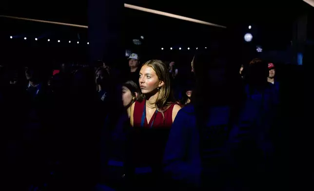 Attendees listen during Turning Point USA's AmericaFest 2025, Thursday, Dec. 18, 2025, in Phoenix. (AP Photo/Jon Cherry)
