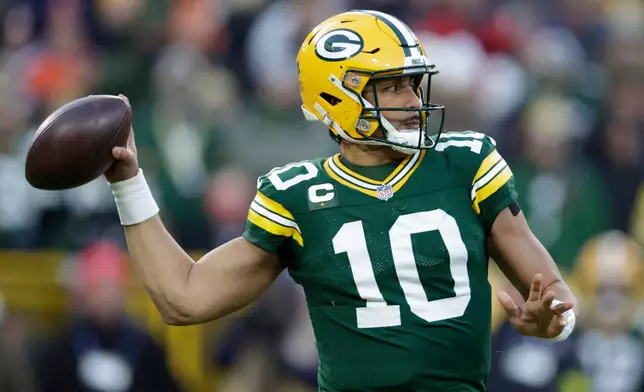 Green Bay Packers quarterback Jordan Love looks to throw a pass against the Chicago Bears during the first half of an NFL football game Sunday, Dec. 7, 2025, in Green Bay, Wis. (AP Photo/Matt Ludtke)