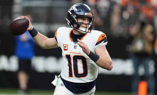 Denver Broncos quarterback Bo Nix (10) passes against the Las Vegas Raiders during the first half of an NFL football game in Las Vegas, Sunday, Dec. 7, 2025. (AP Photo/Gregory Bull)
