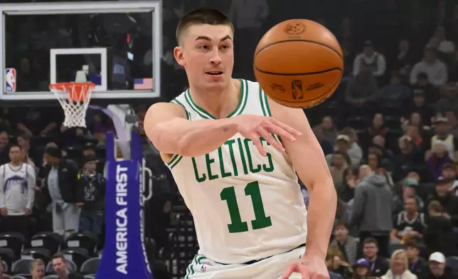 Boston Celtics guard Payton Pritchard passes during the first half of an NBA basketball game against the Utah Jazz, Tuesday, Dec. 30, 2025, in Salt Lake City. (AP Photo/Tyler Tate)