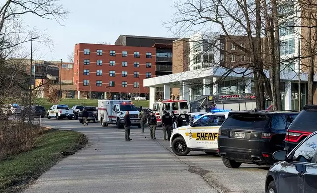 FILE - Law enforcement responds to a shooting at Whitney Moore Young Jr. Hall on Kentucky State University's campus in Frankfort, Ky., Tuesday, Dec. 9, 2025. (Hannah Brown/The State Journal via AP, File)