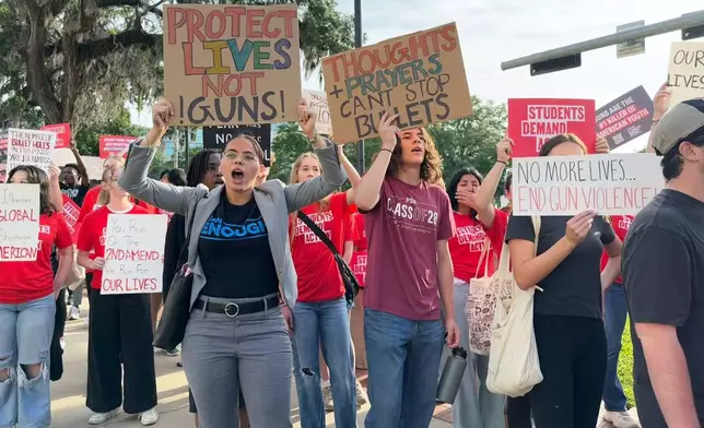 FILE - Students and activists rally for gun control policies outside of Florida's historic old capitol on Wednesday, April 23, 2025 in Tallahassee, Fla., less than a week after a deadly shooting at Florida State University. (AP Photo/Kate Payne, File)