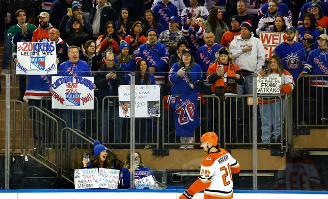 New York Rangers fans react to Anaheim Ducks' Chris Kreider skating during warmups before an NHL hockey game against the New York Rangers, Monday, Dec 15, 2025, in New York. (AP Photo/Noah K. Murray)