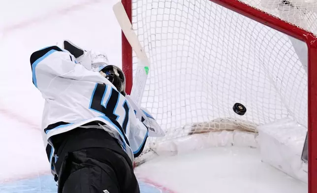 Utah Mammoth goaltender Vitek Vanecek dives back but can't make the save on a goal by Boston Bruins center Morgan Geekie during the first period of an NHL hockey game, Tuesday, Dec. 16, 2025, in Boston. (AP Photo/Charles Krupa)