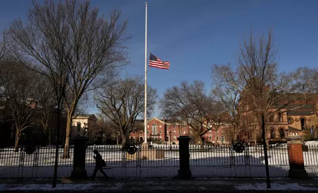 The United States flag flies at half-staff as a sign of mourning for the victim's of Saturday's shooting, on the campus of Brown University, Monday, Dec. 15, 2025, in Providence, R.I. (AP Photo/Robert F. Bukaty)