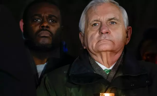 U.S. Rep. Gabe Amo, D-R.I., left, and U.S. Sen. Jack Reed, D-R.I., attend a community gathering at Lippitt Memorial Park a day after a shooting occurred on Brown University campus, Sunday, Dec. 14, 2025, in Providence, R.I. (Lily Speredelozzi/The Sun Chronicle via AP)