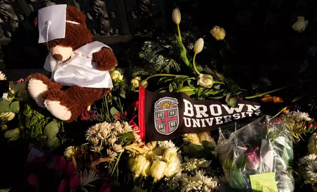 A makeshift memorial is seen on the campus of Brown University, close to from the scene of the shooting, Monday, Dec. 15, 2025, in Providence, R.I. (AP Photo/Robert F. Bukaty)