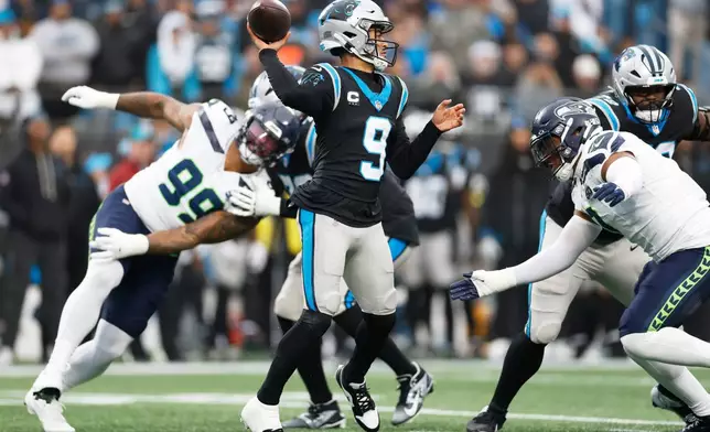 Carolina Panthers quarterback Bryce Young passes against the Seattle Seahawks during the first half of an NFL football game, Sunday, Dec. 28, 2025, in Charlotte, N.C. (AP Photo/Rusty Jones)