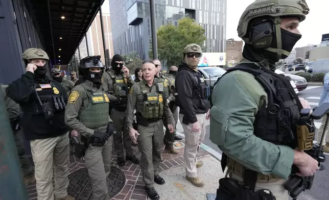 FILE - U.S. Border Patrol Commander at large Gregory Bovino, center, walks on the street in New Orleans, La., Dec. 3, 2025. (AP Photo/Gerald Herbert, File)