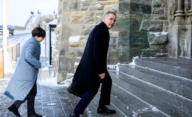 Canadian Prime Minister Mark Carney arrives on Parliament Hill in Ottawa, Canada, Thursday, Dec. 11, 2025. (Spencer Colby/The Canadian Press via AP)