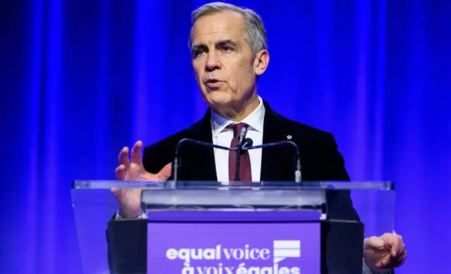 Canada Prime Minister Mark Carney delivers remarks during the annual Equal Voice gala in Ottawa, Ontario, Wednesday, Dec. 10, 2025. (Spencer Colby/The Canadian Press via AP)