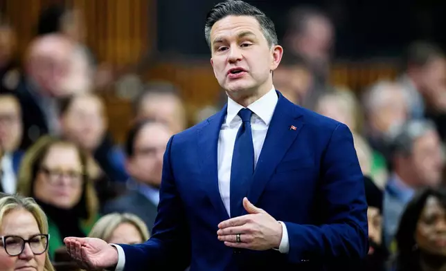 Conservative Leader Pierre Poilievre stands in the House of Commons during Question Period on Parliament Hill in Ottawa, Canada, Thursday, Dec. 11, 2025. (Spencer Colby/The Canadian Press via AP)