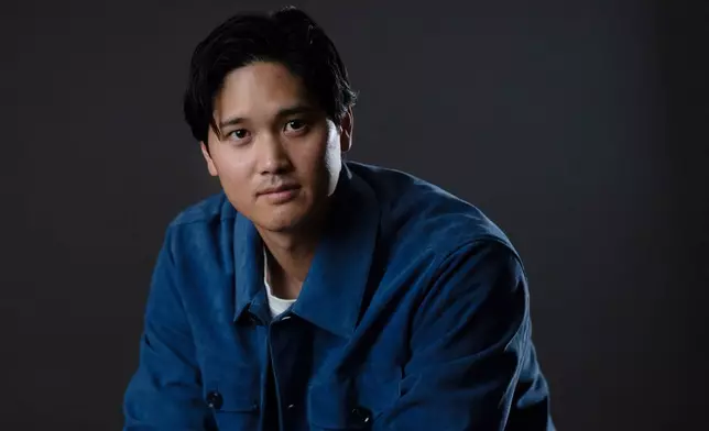 Los Angeles Dodgers' Shohei Ohtani poses for photos after an interview with The Associated Press in Pasadena, Calif., Wednesday, Nov. 26, 2025. (AP Photo/Jae C. Hong)