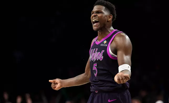 Minnesota Timberwolves guard Anthony Edwards (5) celebrates during the second half of an NBA basketball game against the Oklahoma City Thunder Friday, Dec. 19, 2025, in Minneapolis. (AP Photo/Matt Krohn)